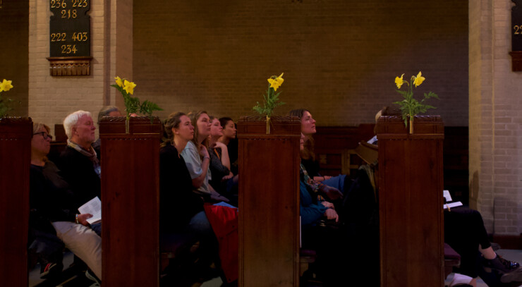 people enjoying the easter sunday service from the pews in elias church