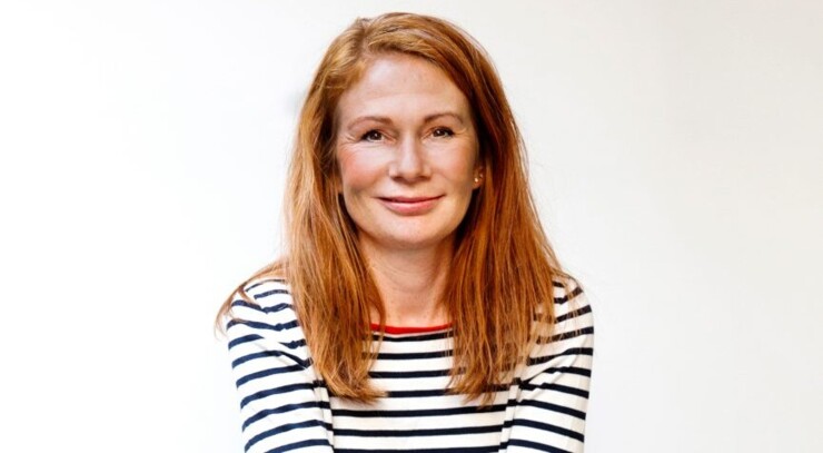 Portrait of Margrethe Vadmand who has red hair and a striped tshirt